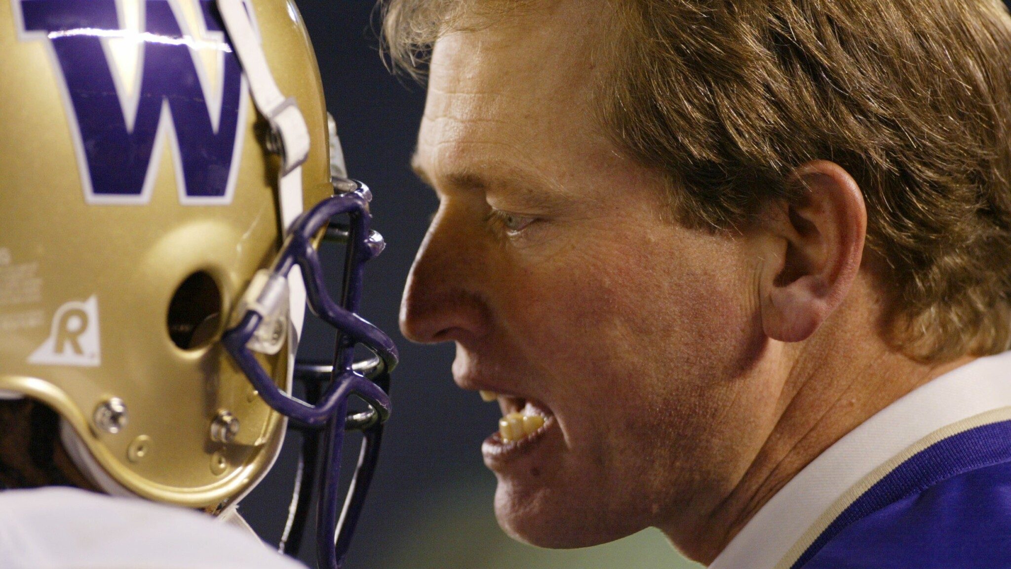 Rick Neuheisel was caught red-handed by a sportswriter in an airport.