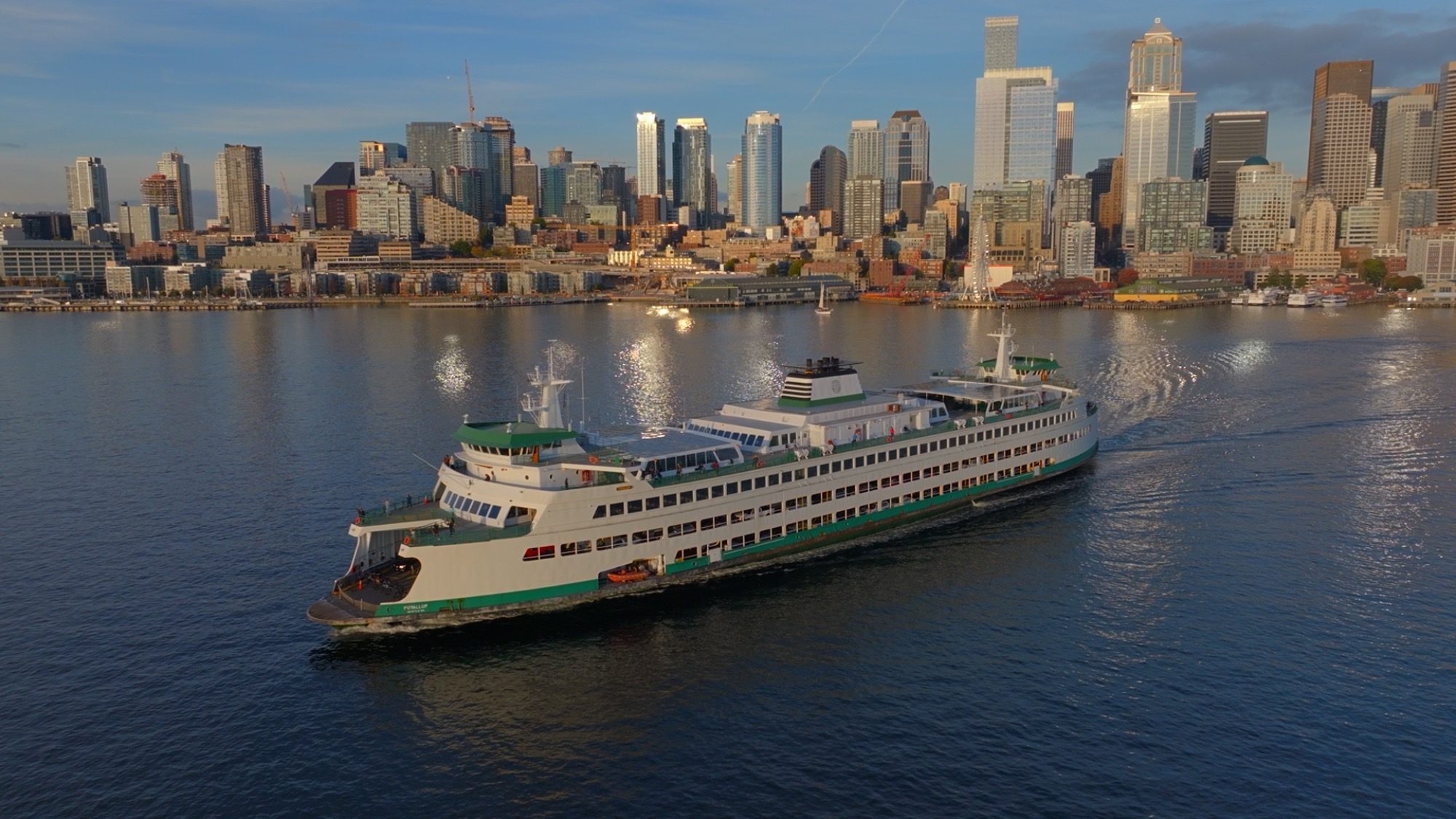 A still frame from Visit Seattle's destination video showing the Bainbridge ferry departing from Seattle.