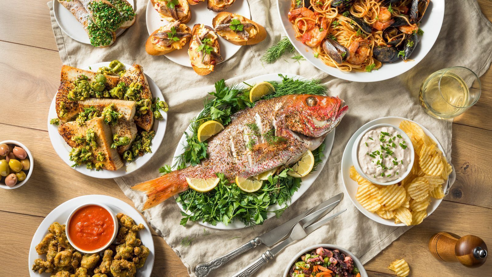 Holiday Italian Feast of 7 Fishes with Snapper Octopus and Pasta.