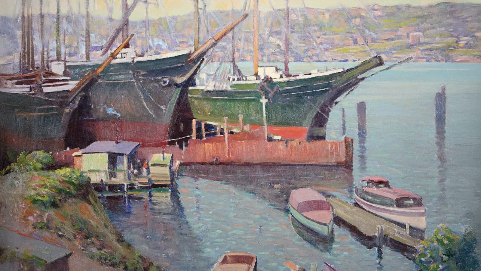 A timeless treasure, this painting captures a harbor scene with several large ships docked, small boats gracefully drifting in the foreground, and a hilly landscape providing a serene backdrop. It would make for a game-changing gift or find its perfect home at the Cascadia Art Museum.