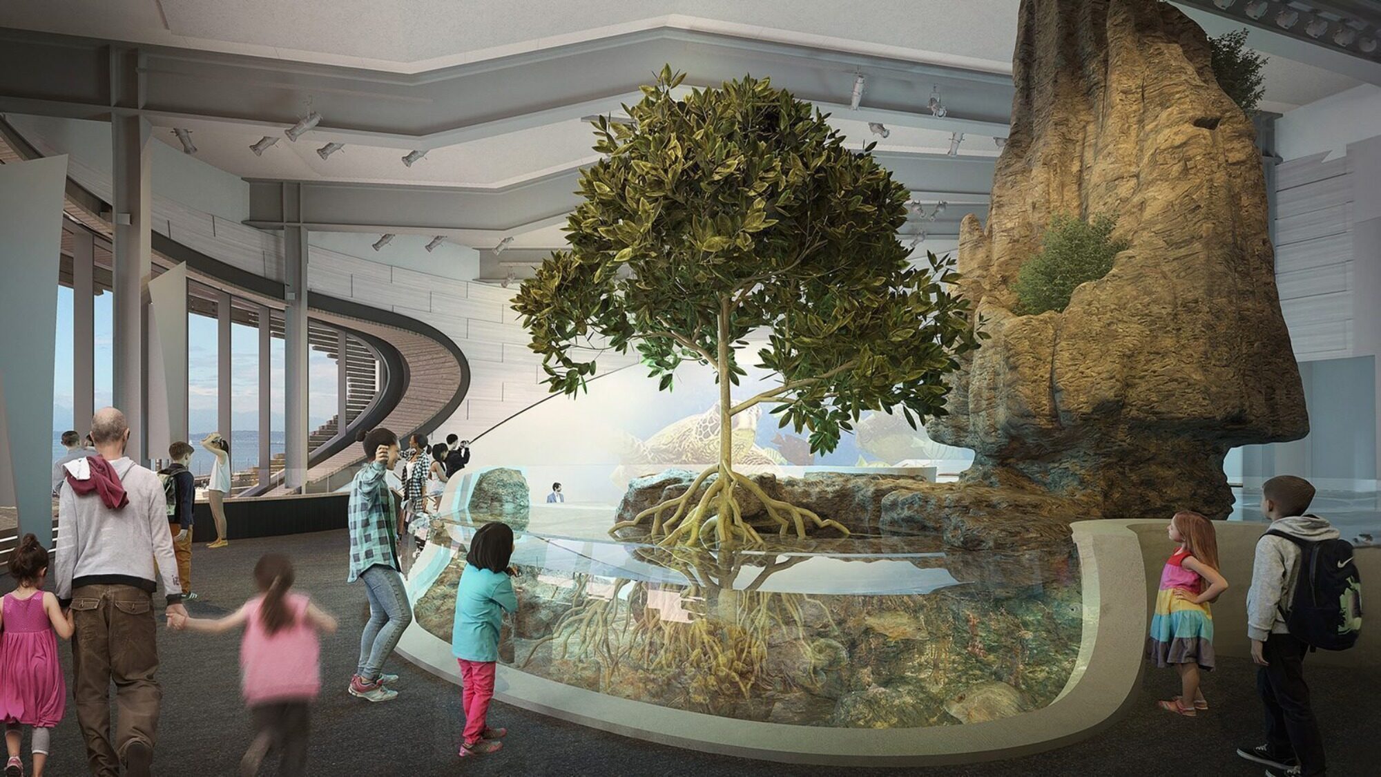 People and children observe an indoor exhibit featuring a large tree with exposed roots and a rock formation, inside a modern, well-lit museum.